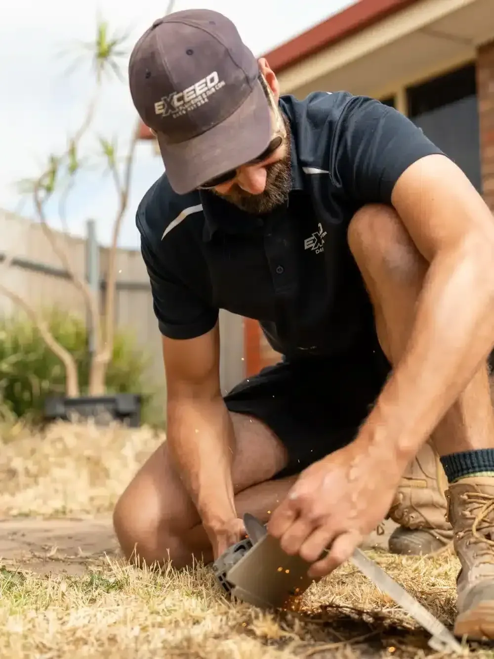 A Windsor Gardens plumber at work on a job